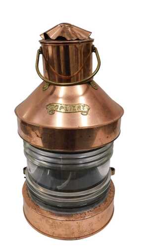 An early 20thC Toplight copper and brass ship's lantern, with glazed front, swing handle, later...