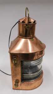 An early 20thC Toplight copper and brass ship's lantern, with glazed front, swing handle, later... - 2