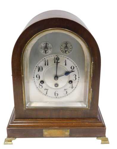 A 1920s mahogany cased eight day chiming mantel clock, with 13cm diameter Arabic chapter ring,...