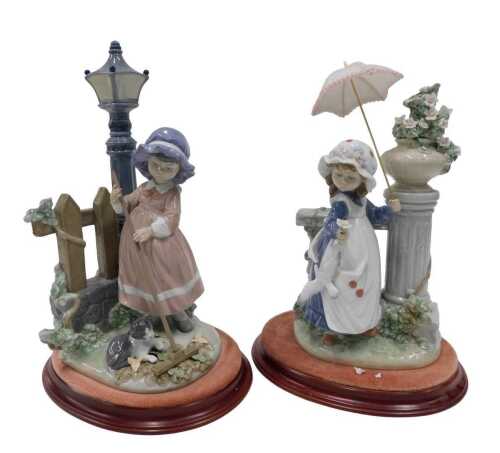 A Lladro figure group Glorious Spring by Ramos, on stand, 31cm high, and another similar. (AF)