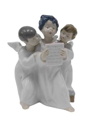 A Lladro figure group of angels, number 4542, 18cm high. (boxed)