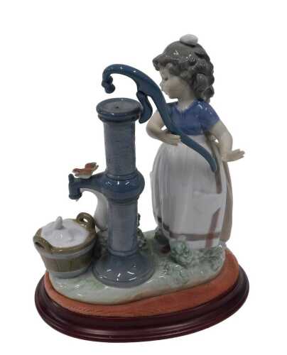 A Lladro figure group Summer on the Farm, number 5285, on stand, 26cm high.