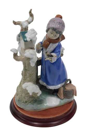 A Lladro figure group Winter Frost, by Ramos, number 5287, on plinth base, 25cm high.
