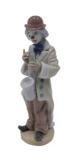A Lladro figure group Sad Sax, number 5471, 21cm high.