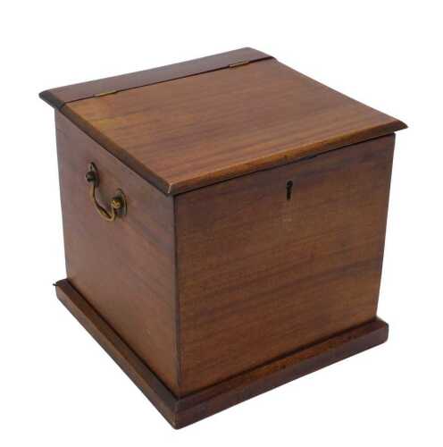 An early 20thC mahogany shoe shine box, of square form with hinged lid, brass swing handles,...