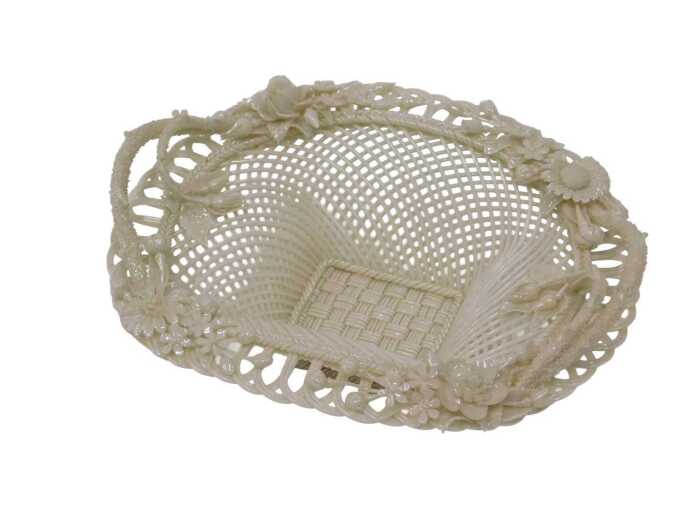 A 19thC Belleek porcelain basket, the border embellished with flowers, possibly by Henshaw and...