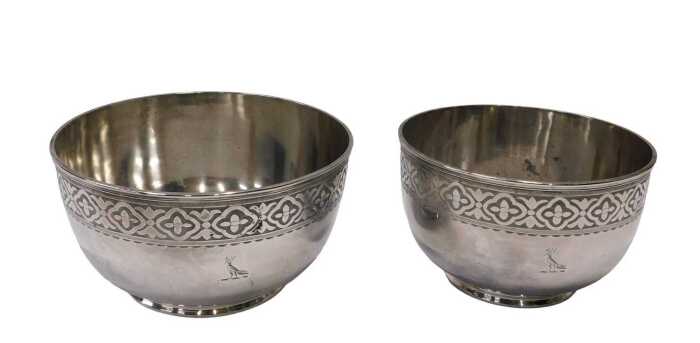 A graduated pair of silver plated bowls, with upper floral and geometric banding, etched with...