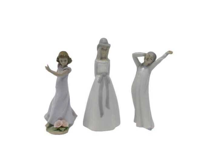A Lladro figure group child aside flowers, 6990, 20cm high, a Nao yawning child and a Valencia...