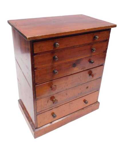 An early 20thC stained pine specimen cabinet, with six graduated drawers, of rectangular form,...