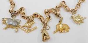 A charm bracelet, with a 9ct rose gold curb link bracelet with safety chain and heart shaped... - 2