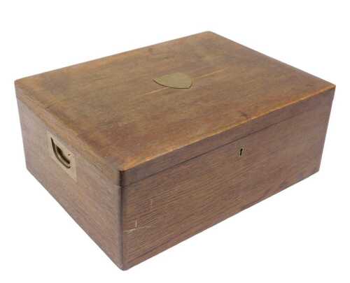An early 20thC oak box, of rectangular form, with brass shield plaque, presented to Mr JR Foster...