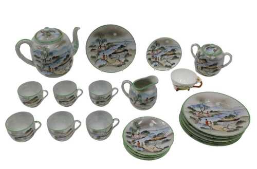 An early 20thC Japanese semi-porcelain part service, profusely decorated with figures,...