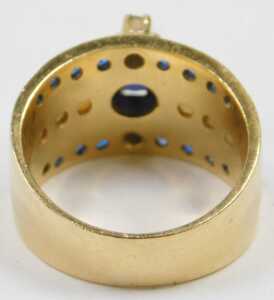 A sapphire, diamond and seed pearl dress ring, of three row design, the central raised round... - 2