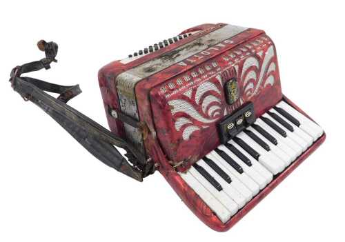 A mid 20thC Galotta piano accordion, in red and chrome coloured Art Deco style, with forty eight...