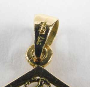 An Arabian pendant, centred with writing and scroll outer border with six drops, yellow metal... - 4
