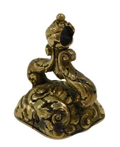 An 18thC style Carnelian wax seal, with scroll loop top and raised floral decoration, set with...