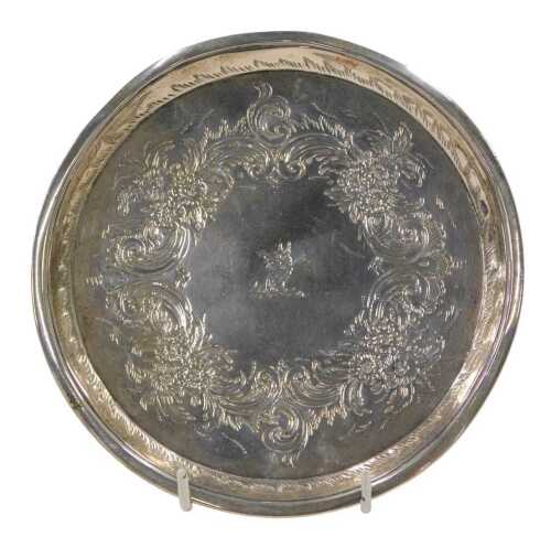 A George III silver waiter, of circular form, etched with scrolls and flowers, with a central...