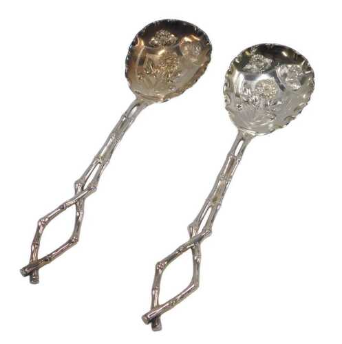 A pair of 19thC aesthetic silver plated serving spoons, each with entwined bamboo handles,...