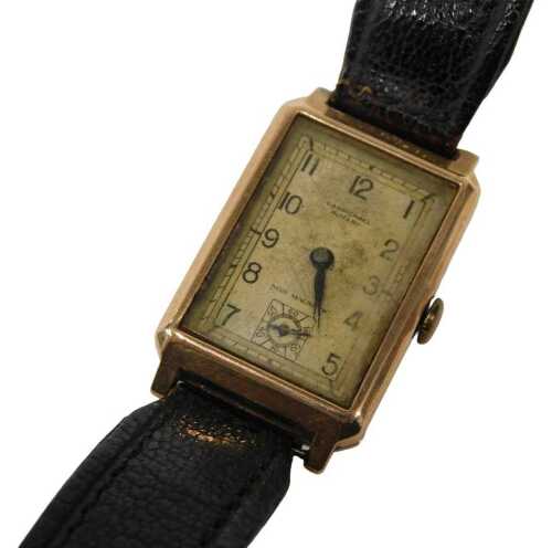 A mid 20thC gentlemen's wristwatch, the rectangular 2cm wide Arabic dial marked Carmichael...