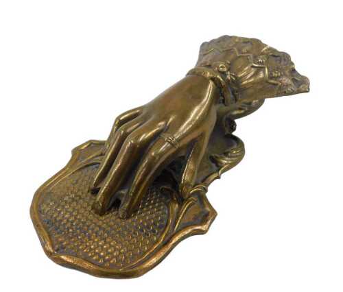 An early 20thC brass articulated Ratcliffe patent hand letter clip, with articulated action,...