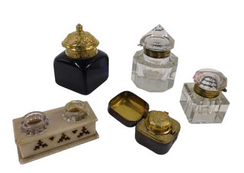 Various inkwells, an early 20thC travelling inkwell in metal casing, 4cm high, marble finish...