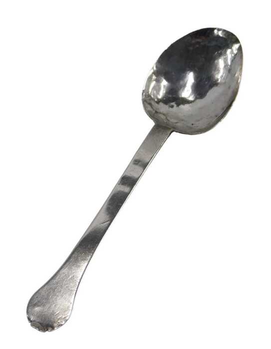 A William III Britannia silver trefid spoon, with plain bowl, initialled and studded with the...