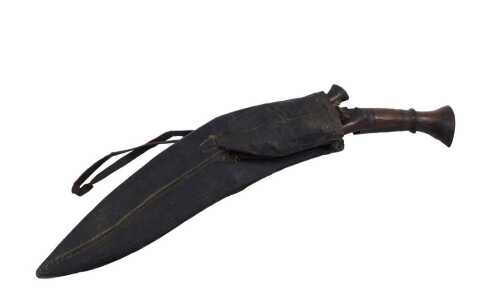 An early 20thC Kukri, with etched curved blade and turned wooden handle, with leather scabbard...
