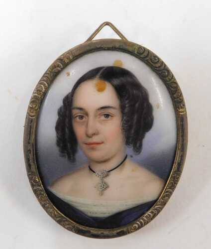 A 19thC Berlin porcelain plaque brooch, of a lady quarter profile dressed in finery, 5cm x 4cm.