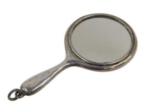 A George V miniature silver hand mirror, of plain circular form with loop end, by Crisford and...