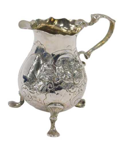A 19thC silver milk jug, with flared rim, thumb mould leaf S scroll handle and bulbous body,...