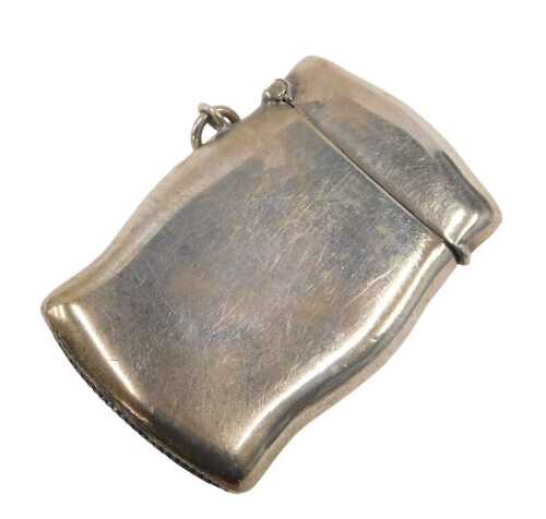 A George V silver Vesta case, of shaped form with match strike base and ring to the side, by...