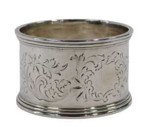 A George VI silver napkin ring, of circular form, part etched with scrolls, leaves and flower...