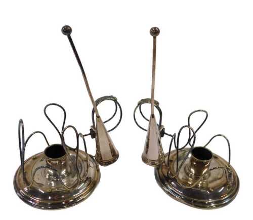 A pair of early 20thC candlesticks, with circular body, wirework surrounds and thumb mould...