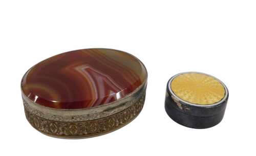 An early 20thC enamel patchbox, of circular form with removable lid in yellow, on an unmarked...