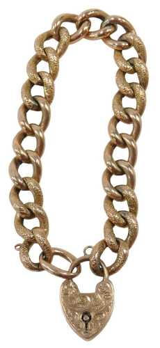 A rose gold curb link bracelet, the hammered links with heart shaped padlock, yellow metal...