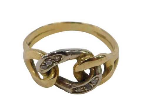 A dress ring, with central white gold coloured link, set with six tiny diamonds, on a yellow...