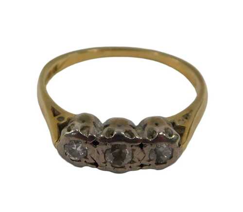 An 18ct gold diamond three stone dress ring, set with three round brilliant cut diamonds, each...