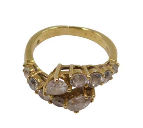 An 18ct gold diamond dress ring, of two row twist design, set with two tear drop cut diamonds...