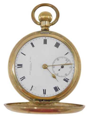 A USA full hunter gold plated pocket watch, with a white enamel Roman numeric dial, with brass...
