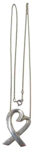 A Tiffany and Co silver pendant, the crossover heart stamped Paloma Picasso 925, the pendant 3cm...