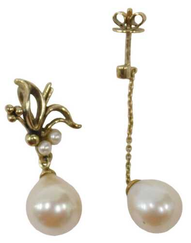 Two single pearl earrings, comprising a 9ct gold pearl and diamond drop earring, on single pin...