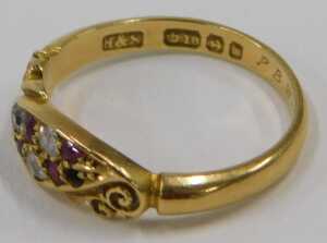 An 18ct gold ruby and diamond crossover ring, the central marcasite panel set with five diamonds... - 2