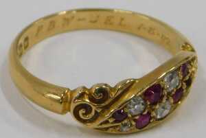 An 18ct gold ruby and diamond crossover ring, the central marcasite panel set with five diamonds... - 3