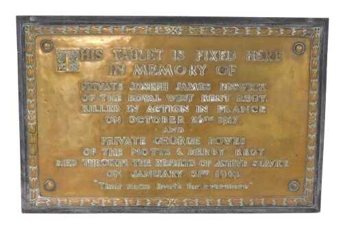 A bronze memorial plaque, on blackened wooden base, This Tablet Fixed Here in Memory of Private...