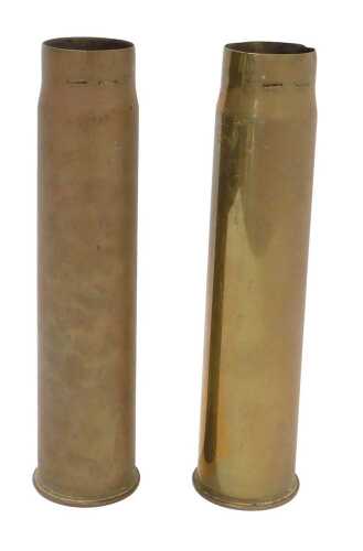 Two British Army six pounder brass shell cases, both dated 1902, of the type used in the first...