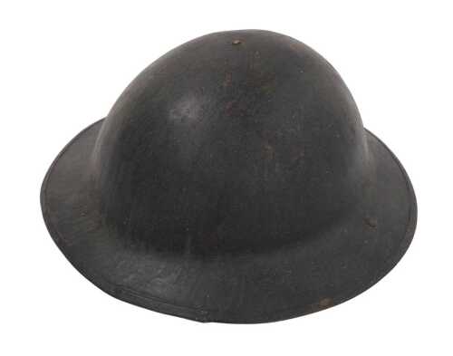 A British Army World War I period Brodie helmet, with remains of original unattached liner and...
