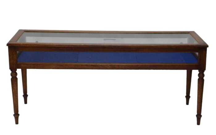 An early 20thC jeweller's shop display cabinet, of rectangular form, with glazed slide doors, on...