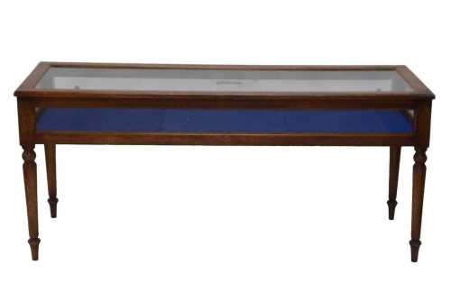 An early 20thC jeweller's shop display cabinet, of rectangular form, with glazed slide doors, on...
