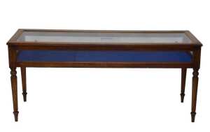 An early 20thC jeweller's shop display cabinet, of rectangular form, with glazed slide doors, on...