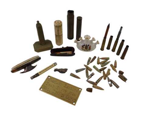 A small collection of militaria, to include excavated bullet heads, brass .303 bullet casings, a...